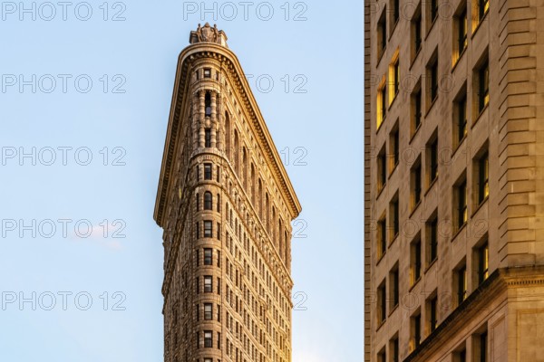 Low angle view of Flatiron Building in Manhattan against blue sky