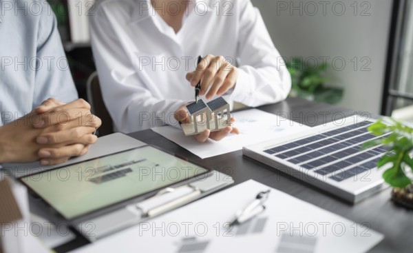 Solar panels green energy Business man working green eco friendly office business creative idea Planing Bio economy for business eco friendly professional Engineer sustainable electricity