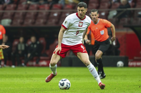 WARSAW, POLAND - MARCH 21, 2025: Qualifications for FIFA World Championship 2026. Match Poland - Lithuania 1:0. In action Robert Lewandowski