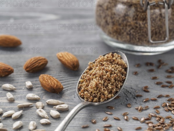 Homemade LSA mix in spoon - Linseed or flax seeds, Sunflower seeds and Almonds. Traditional Australian blend of ground, source of dietary fiber, protein, omega fatty acids. Copy space for text