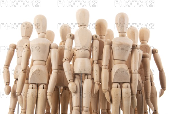 Many wooden mannequins isolated over white
