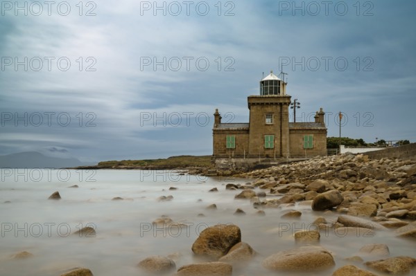 A long exposure view of the historic 19th-century Blacksod Lighthouse on the Mullet Peninsula in County Mayo in Ireland