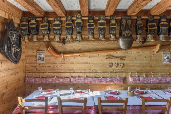 Cow bells displayed in restaurant of mountain farm. Vosges, Alsace, France