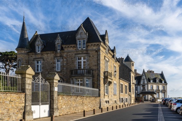 Roscoff, France, July 31, 2018: Old residential buildings and health resorts at evening against sky