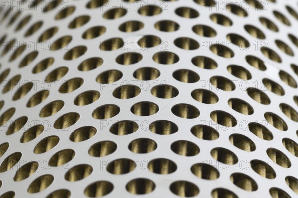 Detail of a tractor oil filter creates an industrial textured background