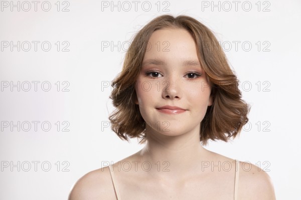 A captivating portrait of a stunning young woman with wavy hair, showcasing her confidence and elegance