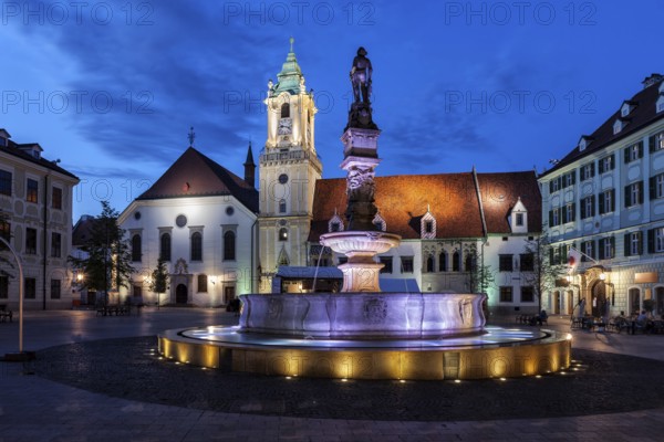 City of Bratislava at night in Slovakia, Roland Fountain, Old Town Hall building and Jesuit Church at Main Market Square
