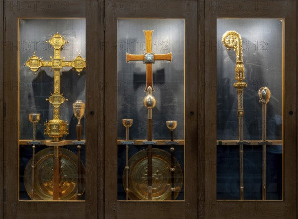 Chester, United Kingdom, 26 August, 2022: ornate golden crosses and Bishop staff in a display case inside the historic Chester Cathedral