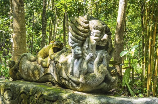 Monkey sculpture in sacred Monkey Forest park, Ubud, Bali, Indonesia