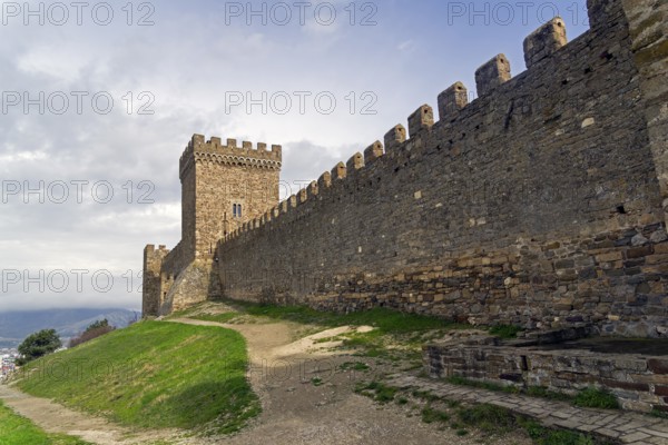 Genoese fortress in Sudak, Crimea.The Citadel and the wall of the upper tier of defense. Cloudy day, early April