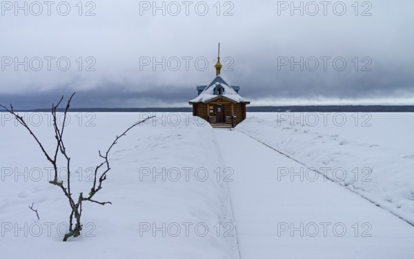 Chapel of St. John the Baptist (baptistery) in Orthodox monastery. Vygozero, Karelia, Russia. Cloudy day, the beginning of March