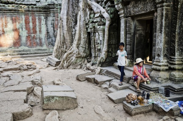 Souvenir trinket stall vendor in angkor wat famous landmark buddhist temple ruins near siem reap cambodia