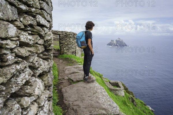 Visitors on the steep path up to the monastery, Skellig Michael island, Mainistir Fhionáin (St. Fionan?s Monastery), county Kerry, Ireland, United Kingdom