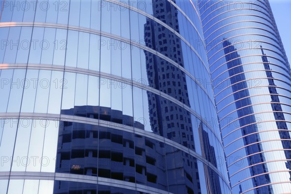 Blue mirror glass facade skyscraper buildings city of Houston Texas