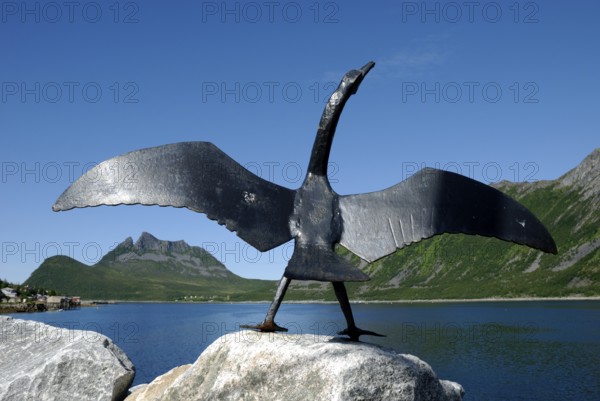 Sculpture of a cormorant at the harbour in Gryllefjord, Senja, Troms, Norway