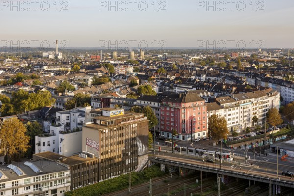 View over Düsseldorf, Wehrhahn stop on Grafenberger Allee, in the background the cooling towers of the Flingern thermal power station and the municipal utilities' waste incineration plant, Düsseldorf, North Rhine-Westphalia, Germany