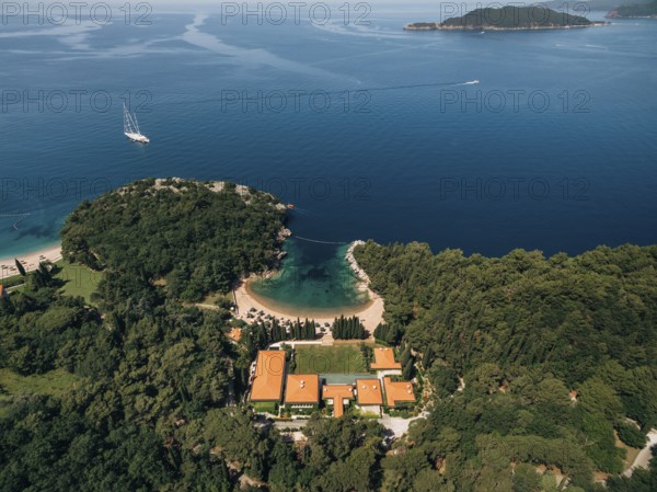 Budva, Montenegro - 10 june 2019: Hotel spa Aman Resorts Sveti Stefan. A luxury hotel on the Adriatic coast in Montenegro. Beach and coastline. Aerial photo. The concept of a rich luxury life