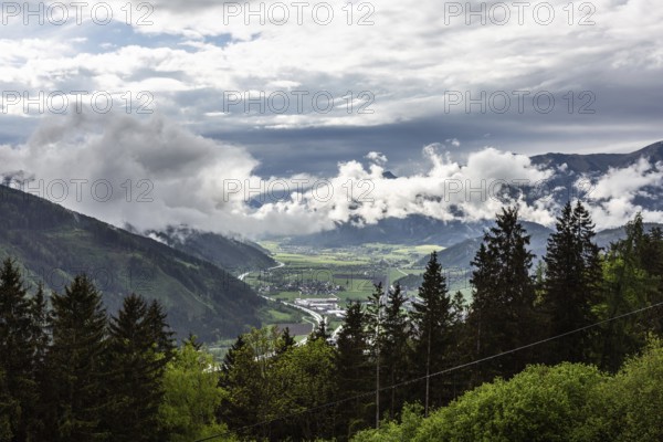 Clouds and fog over the Liesingtal, in the valley the village Traboch, Schoberpass federal road, view from the lowlands, Leoben, Styria, Austria