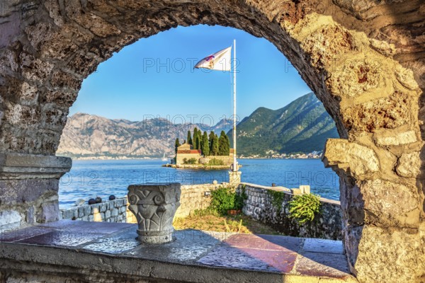 View on St George island from Our Lady of the Rocks through arch. Perast, Montenegro