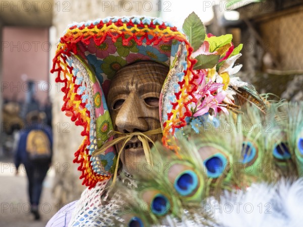 Shignano Italy 21/02/2023: The carnival of Schignano parade is one of the most famous traditional carnivals of north Italy with typical wood masks and performer that entertain the visitors