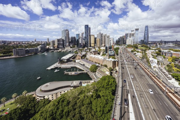SYDNEY, AUSTRALIA, MARCH 4 2023: The Sydney CBD and surrounding harbour, including Circular Quay and The Rocks on a clear autumn day in Sydney, Australia