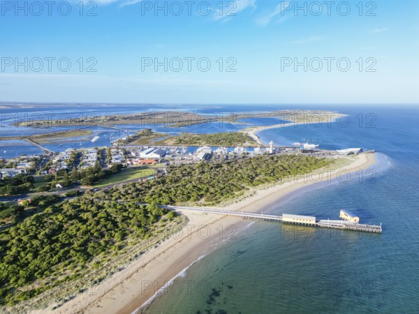 Aerial views of Queenscliff pier and Sorrento ferry area at dusk on a summer's day on the Bellarine Peninsula, Victoria, Australia