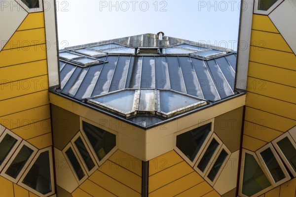 Rotterdam, Netherlands, May 8, 2022: Yellow cubic houses in Rotterdam. The Cubic Houses were designed by Piet Blom architect
