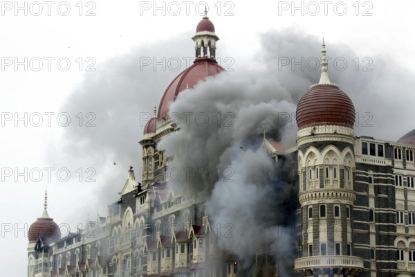 Smoke emits from Taj Mahal Hotel during terrorist attack, Bombay Mumbai, Maharashtra, India 29-November-2008