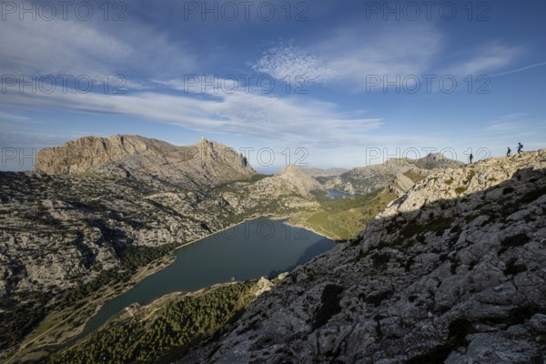 Trekkers on the crest of the Puig de Rateta with the Puig Major in the background, Escorca, Mallorca, Balearic Islands, Spain