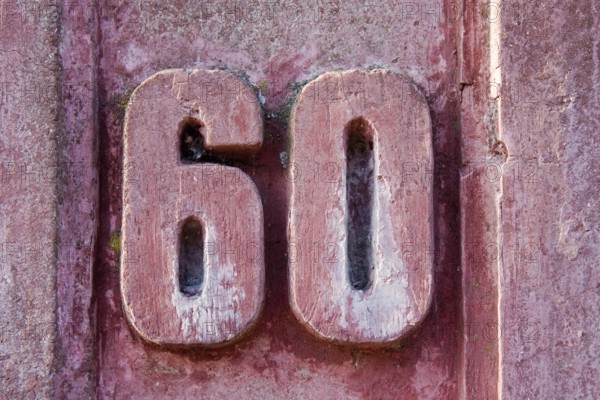 House number 60 on an old wall House number 60 on an old wall