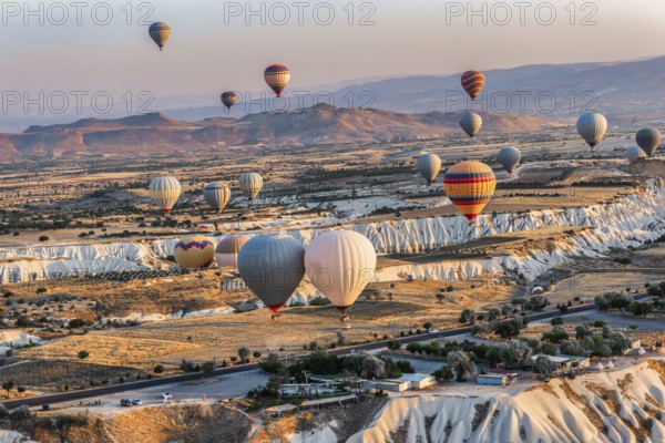 Hot air balloons in the valleys of Cappdocia at sunrise, Turkey