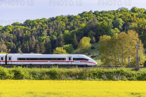 InterCityExpress ICE travelling across the Swabian Alb. Idyllic landscape in spring. Lonsee, Baden-Württemberg, Germany