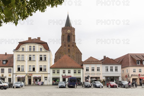 East side of the market square, behind it the town church St.Marien, old town of Beeskow, Brandenburg, Germany