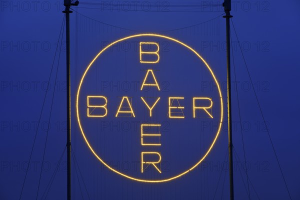 Bayer Cross, the world's largest illuminated sign with 1, 710 LED lights in the evening, Bayer AG, Leverkusen, North Rhine-Westphalia, Germany