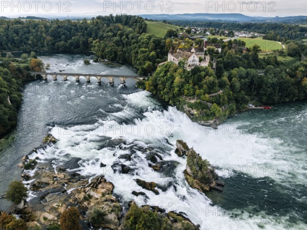Aerial view of the Rhine Falls with railway viaduct and Laufen Castle in autumn, Neuhausen, Canton Schaffhausen, Switzerland