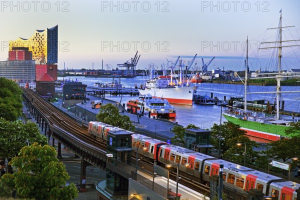 View of Hamburg harbour with museum ship Cap San Diego, elevated railway along the Elbe promenade and Elbphilharmonie concert hall, Germany