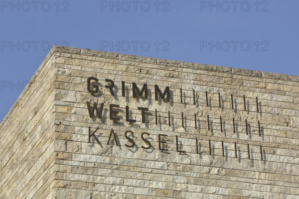 Building of Grimmwelt Museum with inscription, Grimm, world, Brothers Grimm, roof, corner of house, Kassel, Hesse, Germany