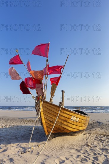 Traditional wooden fishing boat on the beach along the Baltic Sea at Stubbenfelde, Loddin on the island Usedom, Mecklenburg–Western Pomerania, Germany