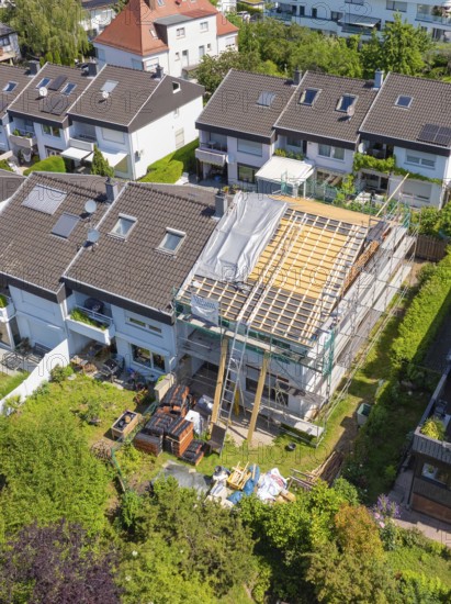 Renovation of a roof in a city environment with scaffolding and summer weather, roof renovation, house construction, Pforzheim, Germany