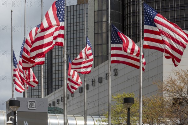 Detroit, Michigan - American flags flying in front of the General Motors headquarters in the Renaissance Center