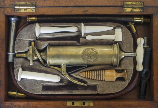 19th century set with instruments for Gastric lavage, stomach pumping, gastric irrigation in antique wooden box