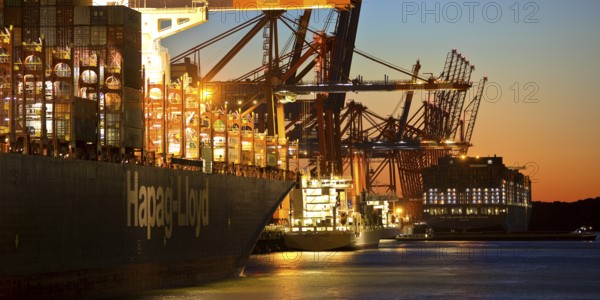 Container ships at the Eurogate container terminal in the evening with an atmospheric sunset, harbour, Hamburg, Germany