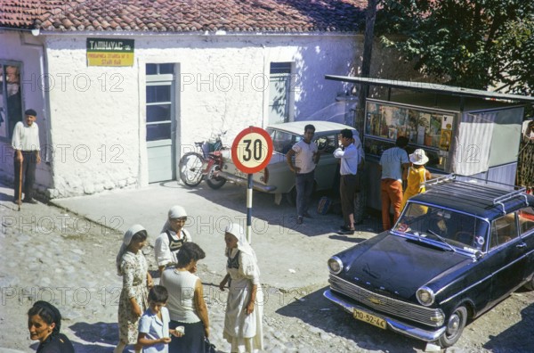 People women wearing traditional clothing street of Stari Bar, Montenegro, former Yugoslavia, Europe 1970 - Opel Rekord Olympia car