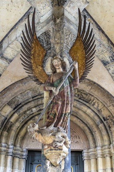 Tower porch with statue of St Michael the Archangel. Protestant parish church of St Michael. As Johannes Brenz's place of work, it was the starting point of the Reformation in the territory of the imperial city after 1523. Schwäbisch Hall, Baden-Württemberg, Germany