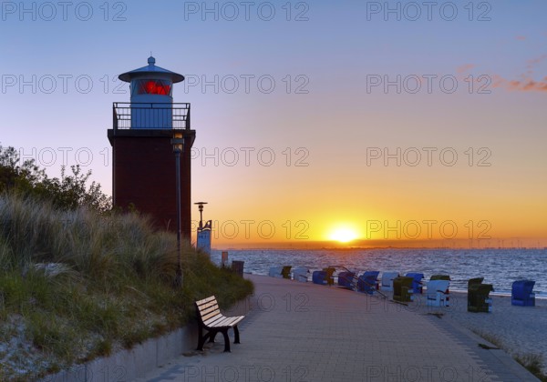 Olhörn lighthouse at colourful sunrise over the sea on the North Frisian island of Föhr, Schleswig-Holstein, Germany