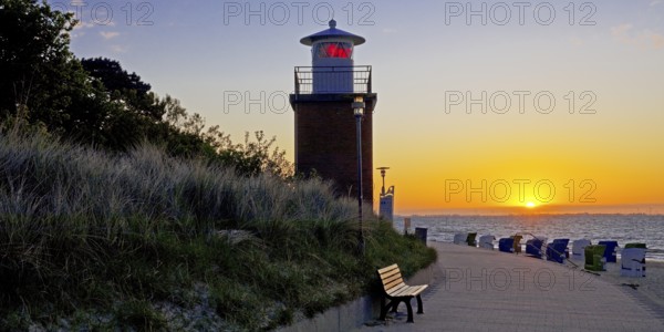 Olhörn lighthouse at colourful sunrise over the sea on the North Frisian island of Föhr, Schleswig-Holstein, Germany