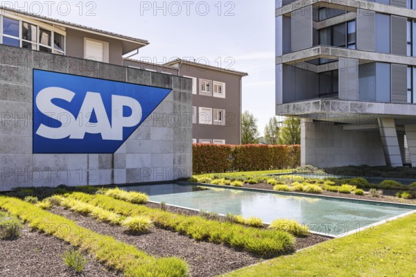 Logo and building of the listed software company SAP, headquarters. Walldorf, Baden-Württemberg, Germany