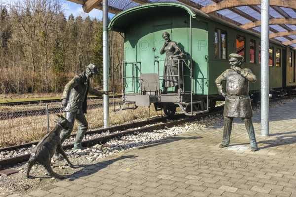Durlesbach railway station, opened in 1849 and decommissioned in 1984, railway monument, railway memorial, group of figures by the artist René Auer, group of sculptures, scene from the song Auf de schwäbische Eisebahne, billy goat, woman, farmer, conductor, s Bäuerle, Konduktör, s Weible, bronze figures, Königlich Württembergischen Staats-Eisenbahnen, Durlesbach, Reute, Bad forest lake, Upper Swabia, Baden-Württemberg, Germany