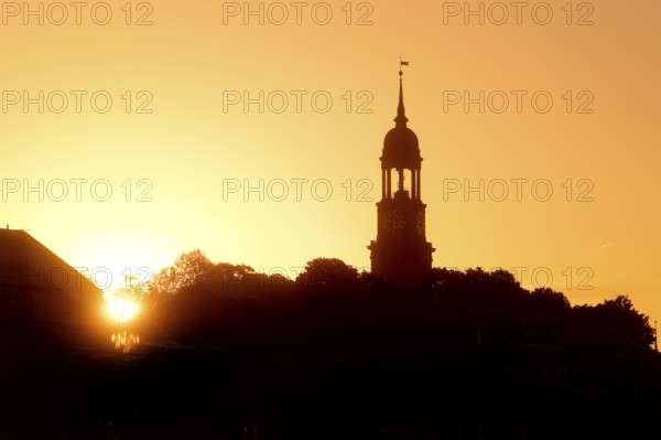 Church tower of the main church St Michaelis, called Michel, at atmospheric sunrise, Hamburg, Germany