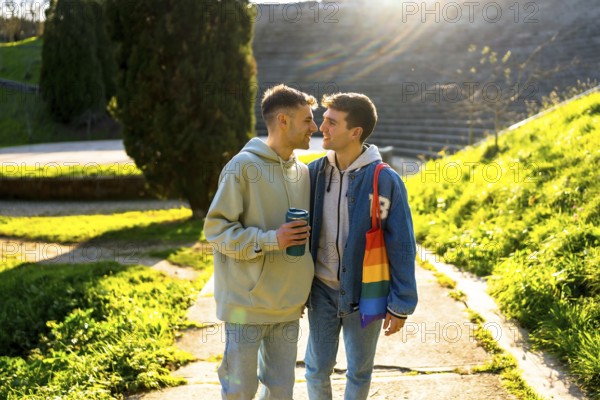 Romantic gay couple enjoying a sunny day in the park, sharing tender moments of love and affection while basking in the warmth of spring
